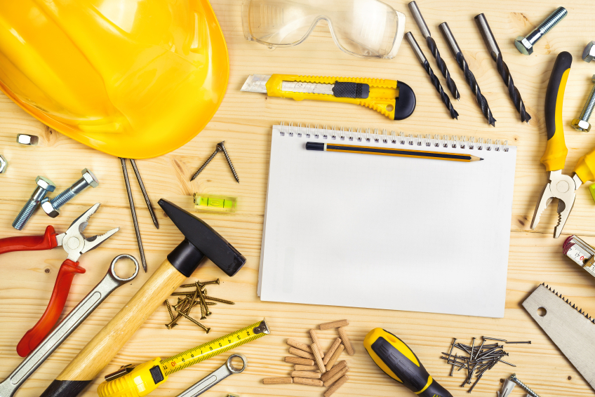 Planning a Project in Carpentry and Woodwork Industry, Notebook and Assorted Woodwork and Carpentry Tools on Pinewood Workshop Table.