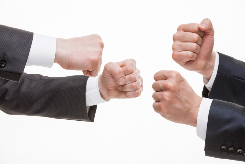 Businessman's hands demonstrating a gesture of a strife, white background